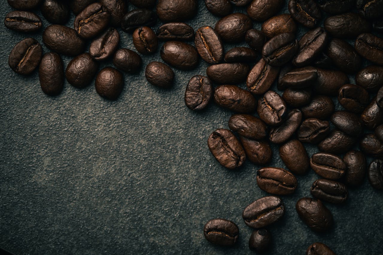 hero-img-01 A detailed close-up of roasted coffee beans, ideal for coffee lovers and cafe themes.
